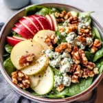A winter salad - spinach, apple, gorgonzola and candied walnuts